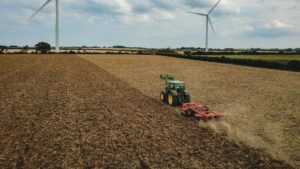 Tractor farming a field in the UK